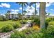 Landscaped walkway winds through lush tropical foliage at 7446 Palm Island Dr # 3514, Placida, FL 33946