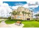 Building with landscaping and bench at 10540 Amberjack Way # 302, Englewood, FL 34224