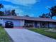 Charming single-story home with well-maintained front yard and paved driveway at 745 Coral Way, Englewood, FL 34223