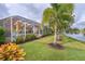 Beautiful backyard oasis with lush landscaping and lake view at 8580 Eagle Bay Ct, North Port, FL 34287