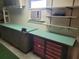 Well-equipped workshop with workbenches and tool storage at 745 Coral Way, Englewood, FL 34223