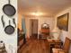 Dining area with wooden table and chairs, and hallway access at 745 Coral Way, Englewood, FL 34223