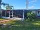 Screened patio and walkway to the backyard at 745 Coral Way, Englewood, FL 34223