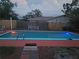 Inviting rectangular pool at night with blue lighting at 745 Coral Way, Englewood, FL 34223