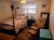 Bedroom with a double bed and a comfy armchair at 745 Coral Way, Englewood, FL 34223