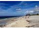 Expansive beach view on a bright sunny day at 745 Coral Way, Englewood, FL 34223