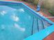Clean, refreshing swimming pool with steps at 745 Coral Way, Englewood, FL 34223