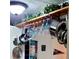 Close-up view of kitchen pot and pan racks, wine glass holders, and other kitchen items at 745 Coral Way, Englewood, FL 34223