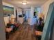 Dining area with kitchen access and wood-look floors at 745 Coral Way, Englewood, FL 34223