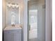 Modern bathroom featuring a gray vanity and glass shower at 495 Coral Creek Dr, Placida, FL 33946