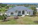 Single-Gathering home with metal roof and manicured lawn at 495 Coral Creek Dr, Placida, FL 33946