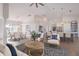 Open living room with kitchen and pool view at 495 Coral Creek Dr, Placida, FL 33946