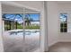 Inviting pool and spa with screened enclosure and golf course view at 495 Coral Creek Dr, Placida, FL 33946