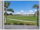 View of a putting green from a patio at 495 Coral Creek Dr, Placida, FL 33946