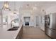 Modern kitchen with white cabinets and stainless steel appliances at 495 Coral Creek Dr, Placida, FL 33946