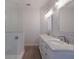 Elegant bathroom with double vanity and marble countertop at 495 Coral Creek Dr, Placida, FL 33946