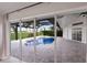 Relaxing pool area with screened enclosure and view of the golf course at 495 Coral Creek Dr, Placida, FL 33946