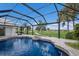 Screened pool and spa with a gorgeous golf course view at 495 Coral Creek Dr, Placida, FL 33946