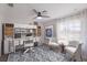 Home office features built-in shelving, comfortable seating, and natural light at 495 Coral Creek Dr, Placida, FL 33946