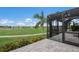 Screened patio overlooking a golf course at 495 Coral Creek Dr, Placida, FL 33946