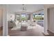 Spacious living room with vaulted ceilings, sliding glass doors, and pool views at 495 Coral Creek Dr, Placida, FL 33946
