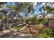 Large backyard with a play area and screened patio at 7192 N Paragon Rd, North Port, FL 34291