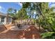 Charming backyard with fire pit, seating area, and a wooden swing at 7192 N Paragon Rd, North Port, FL 34291