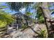 Pathway to screened patio with lush landscaping at 7192 N Paragon Rd, North Port, FL 34291