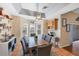 A cozy dining area with a wooden table and gray chairs, adjacent to built-in shelving at 7192 N Paragon Rd, North Port, FL 34291