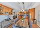 Open kitchen with a breakfast nook and light wood cabinets, showcasing a tiled backsplash at 7192 N Paragon Rd, North Port, FL 34291
