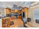 Kitchen with wood cabinets, stainless steel appliances, and a tiled backsplash at 7192 N Paragon Rd, North Port, FL 34291