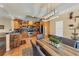Kitchen with an island, light wood cabinets, and a breakfast nook with a view into the dining room at 7192 N Paragon Rd, North Port, FL 34291