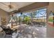 Relaxing screened patio with brick flooring and a stone water feature at 7192 N Paragon Rd, North Port, FL 34291