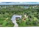 Single-story home with solar panels and tropical landscaping at 120 Barracuda Dr, Placida, FL 33946