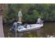 Two people fishing from a small motorboat in a waterway at 120 Barracuda Dr, Placida, FL 33946