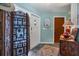 Bright entryway with tiled floors, decorative screen, and coat rack at 120 Barracuda Dr, Placida, FL 33946