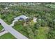 Single-story home with solar panels and tropical landscaping at 120 Barracuda Dr, Placida, FL 33946