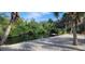 Serene waterfront view with lush landscaping and a private dock at 120 Barracuda Dr, Placida, FL 33946