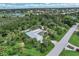 Single-story home with solar panels and tropical landscaping at 120 Barracuda Dr, Placida, FL 33946