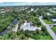 Bird's eye view of home with canal access and tropical setting at 120 Barracuda Dr, Placida, FL 33946