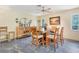 Dining area features a square wooden table with six chairs at 120 Barracuda Dr, Placida, FL 33946