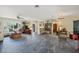 Open living and dining area with tiled floors and ceiling fan at 120 Barracuda Dr, Placida, FL 33946