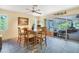 Dining room with a large wooden table and access to a patio at 120 Barracuda Dr, Placida, FL 33946
