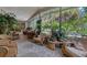 Relaxing screened porch with wicker furniture and tropical plants at 120 Barracuda Dr, Placida, FL 33946