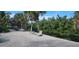 Relaxing backyard oasis with palm trees and canal views at 120 Barracuda Dr, Placida, FL 33946