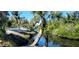 Relaxing waterfront view with palm trees and lush vegetation at 120 Barracuda Dr, Placida, FL 33946