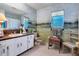 Charming bathroom with unique mural and updated vanity at 120 Barracuda Dr, Placida, FL 33946