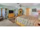 Main bedroom with a king-size bed and access to private patio at 120 Barracuda Dr, Placida, FL 33946