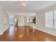 Open concept dining area with hardwood floors and view to the kitchen at 11708 Anglers Club Dr # 125, Placida, FL 33946
