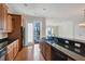 Open concept kitchen with granite counters and views to the backyard at 11708 Anglers Club Dr # 125, Placida, FL 33946
